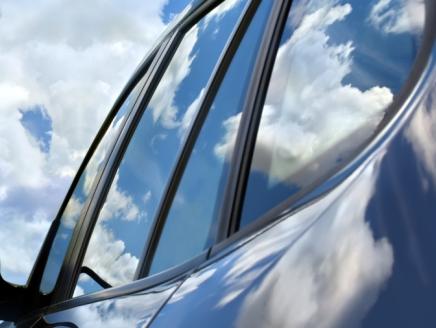 car with blue sky and clouds