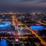 Beijing at night lit up in blue and orange lights