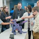 Frank Piotrowski and students at St. Vrain Innovation Center with Belle's Dragon 