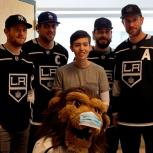 AEG LA Kings players (from left to right) Jonathan Quick, Anze Kopitar, Drew Doughty and Jeff Carter meet and pose with a patient from Children’s Hospital Los Angeles during the team’s annual visit on January 16, 2018.