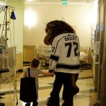 AEG’s LA Kings mascot Bailey walks the halls of Children’s Hospital Los Angeles with a patient during the team’s annual visit to CHLA on January 16, 2018.