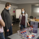 Loos shows fellow co-ops how the model works. A clear ball valve shows what the interior of the valve type looks like and demonstrates its function. Loos shows fellow co-ops how the model works. A clear ball valve shows what the interior of the valve type looks like and demonstrates its function.