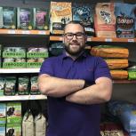 Mike in the dog food aisle of the HugglePets store, prior to the COVID-19 pandemic.