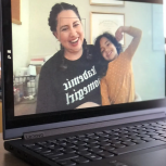 Dr. Maricela Becerra and child on laptop screen