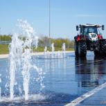 Tractor in front of a water fountain