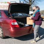 A recent Mill Village Farms drive-through FoodShare Box distribution in Greenville, S.C. A recent Mill Village Farms drive-through FoodShare Box distribution in Greenville, S.C.