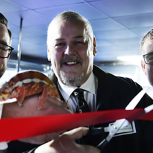 The cutting of the ribbon in January 2020. Mike Dixon (left), Wolverhampton City Council Leader Ian Brookfield (middle) and Ian Dixon (right). And the star of the show, “Rusty” the Panther Chameleon, one of the therapy animals.