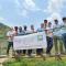 Bridges to Prosperity 2022 Team posing on Kagarama Suspended Bridge in Rwanda