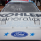 The hood of a race car, "Kohler generators" and ford logo