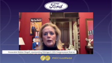 The Honorable Debbie Dingell presents the Gold Medal Award to the Ford Motor Company