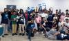 APP YOUniversity students smiling and holding up certificates