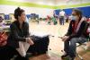 two people talk in a Red Cross shelter