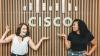 Cisco Logo with two people in front