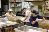  people working in a kitchen