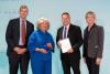 Scott Tew (second from right), Vice President, Sustainability and Managing Director of the Center for Energy Efficiency & Sustainability at Trane Technologies (CEES) accepts Trane Technologies’ induction into the Climate Leadership Awards Hall of Fame. He is joined on stage by Nathaniel Keohane (left) President of C2ES, Mary Nichols (second from left), 2022 Climate Pioneer Award winner, and Amy Holm (right), Executive Director of the Climate Registry.