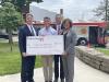  KeyBank Regional Sales Executive Tim Burke (second from right) along with KeyBank East Ohio Market President Eric Dellapina (far left) and KeyBank Regional Retail Leader Becky Talley (far right) present Executive Director of Canton for All People Don Ackerman (second from left) with $200,000 grant.