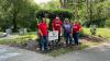 KeyBank volunteers holding a neighbors make the difference sign.