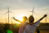 Parent and child looking windfarm