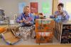 Employees of Post Consumer Brands pack bags of food