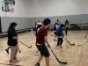Students play ball hockey