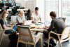 4 people meeting at a table