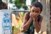 Child drinking water from a spout