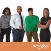 Four people standing in front of a Whirlpool logo