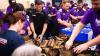 FedEx volunteers assemble crates of care packages