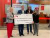 (From left) KeyBank Regional Retail Leader Stacy Radabaugh and Market President Michael McCuen present a KeyBank Foundation grant of $150,000 to Over-The-Rhine Community Housing Executive Director Mary Burke Rivers and OTRCH Board Vice President Georgia Keith. Group is holding a large KeyBank check for $150,000.