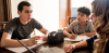 Students sitting around a laptop