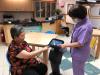 Smart solutions including the use of robots help elderly residents stay digitally connected with their families.